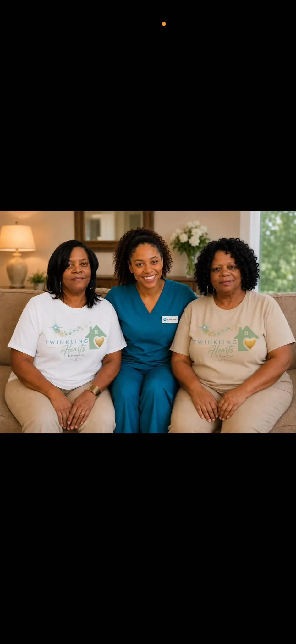 The Twinkling Hearts In Home Care team wearing branded shirts, seated together